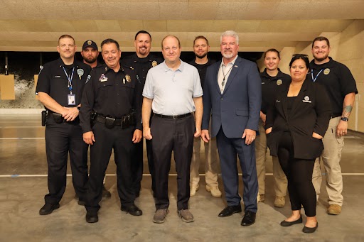 Governor Polis, Colorado Department of Public Safety Executive Director Stan Hilkey, Thornton Police Department Interim Chief Reeves, Councilmember Roberta Ayala and Thornton Police leadership and staff stand for a group photo. 