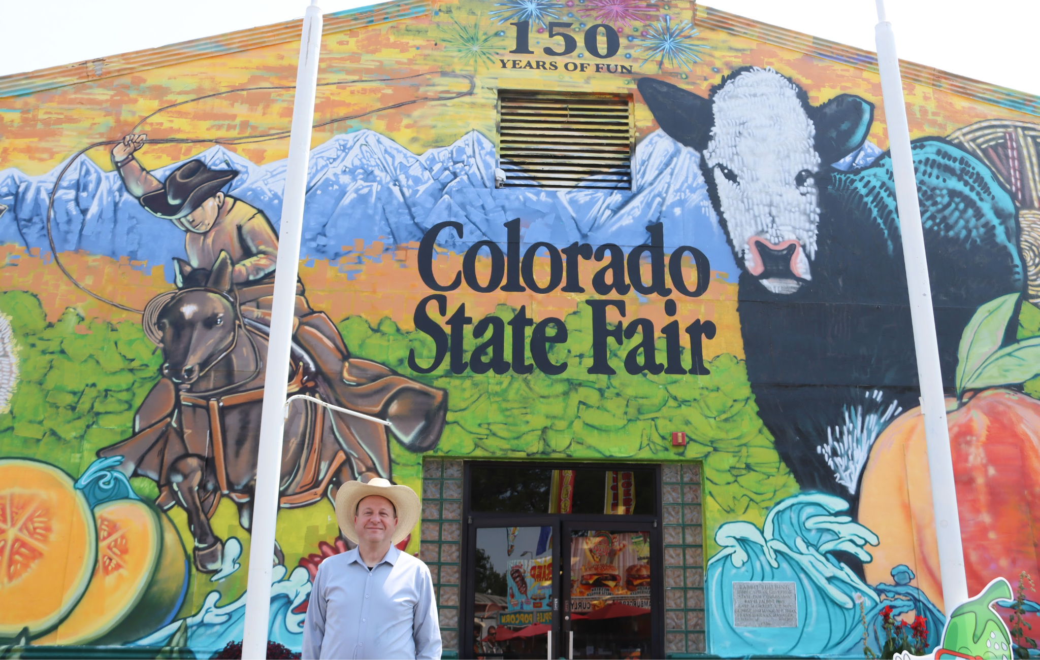 Governor Polis at entrance to Colorado State Fair